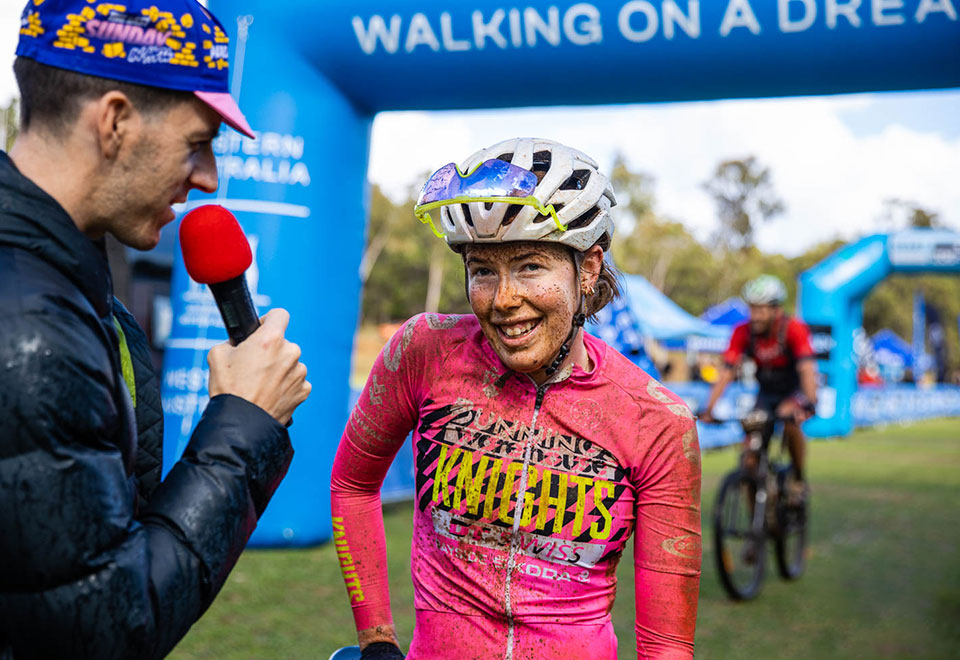 Cassia Boglio being interviewed at the finish line of SEVEN Gravel.